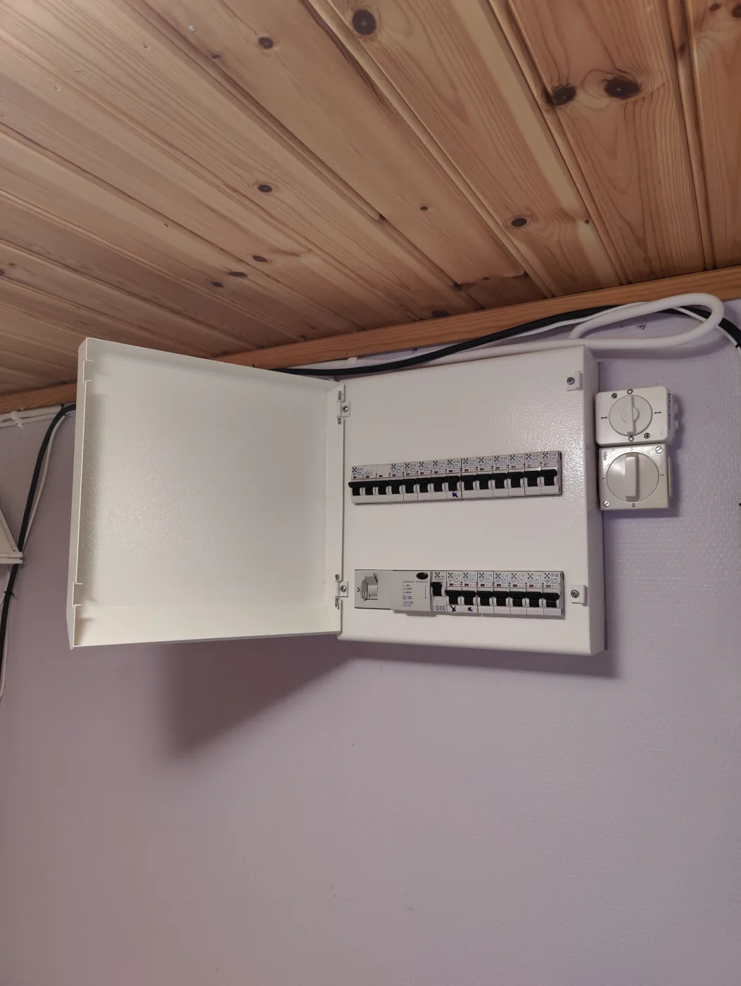 Open electrical distribution board in a Swedish property